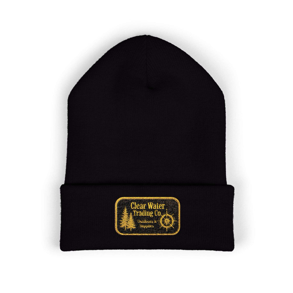 A black knit beanie hat with a folded cuff, featuring a rectangular yellow embroidered patch on the front that reads 'Clear Water Trading Co' with a tree and compass design, shown on a plain white background.