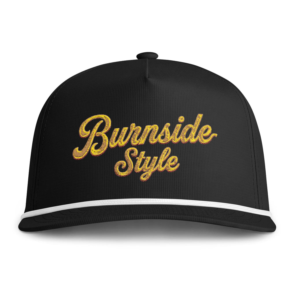 A black baseball cap with 'Burnside Style' embroidered in a textured gold cursive font on the front, featuring a white stripe along the edge of the curved brim.