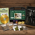 Stone Creek Deluxe Fly Tying Kit with various fly tying materials and tools on a white background.