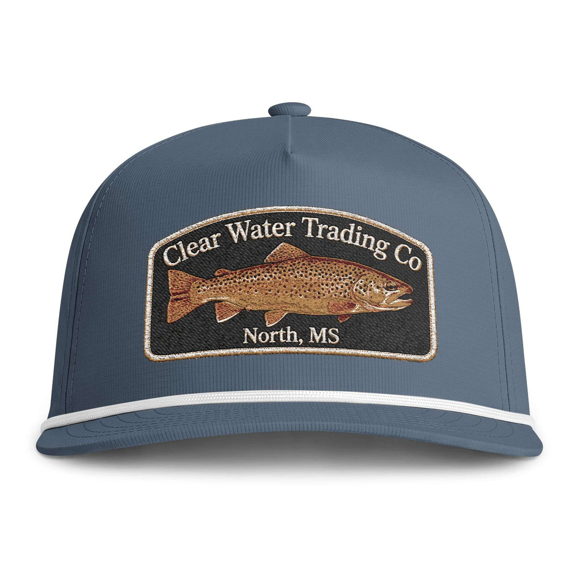 A slate blue baseball cap with a white stripe on the brim and a prominent embroidered patch on the front. The patch features a brown trout illustration and the text 'Clear Water Trading Co' and 'North, MS'.