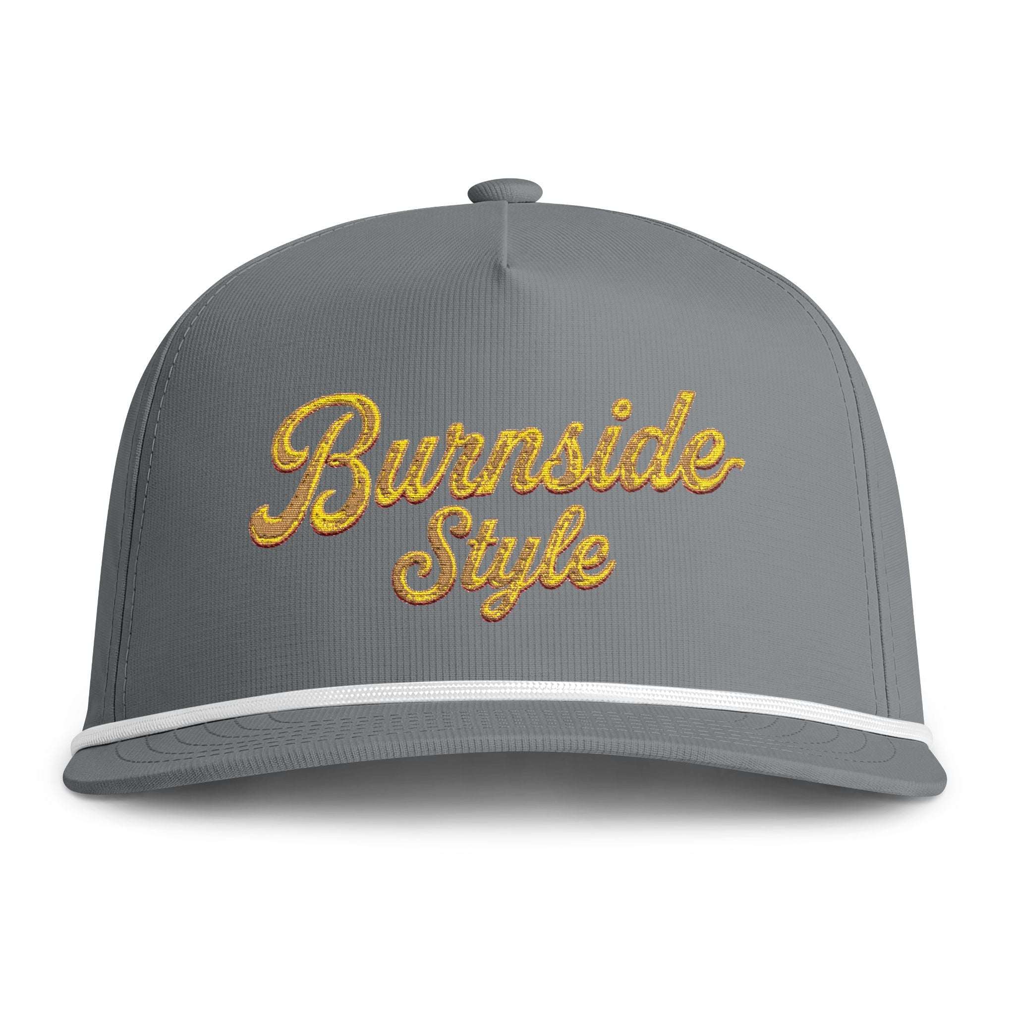 A gray snapback cap with 'Burnside Style' embroidered in gold cursive text on the front, featuring a white stripe along the brim and a gray button on top.