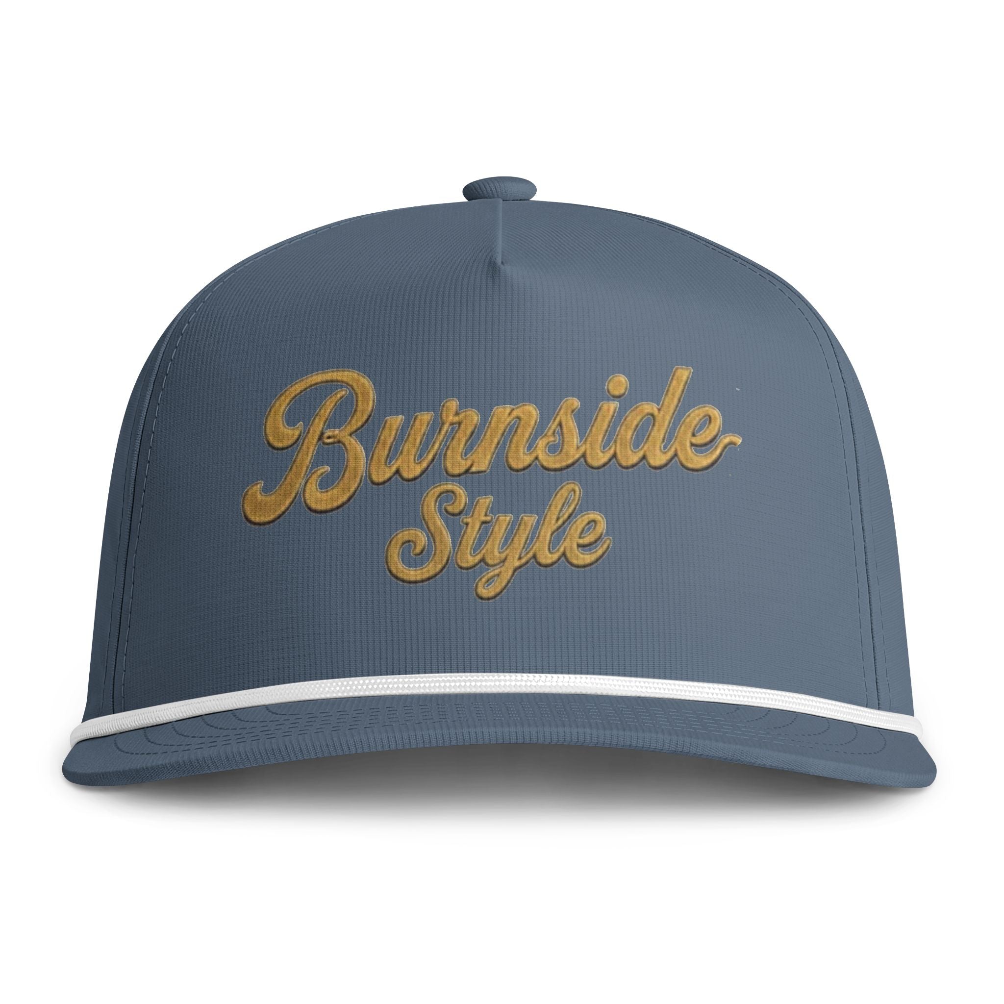 A slate blue snapback cap featuring 'Burnside Style' embroidered in gold cursive script across the front, with a thin white stripe along the edge of the brim.