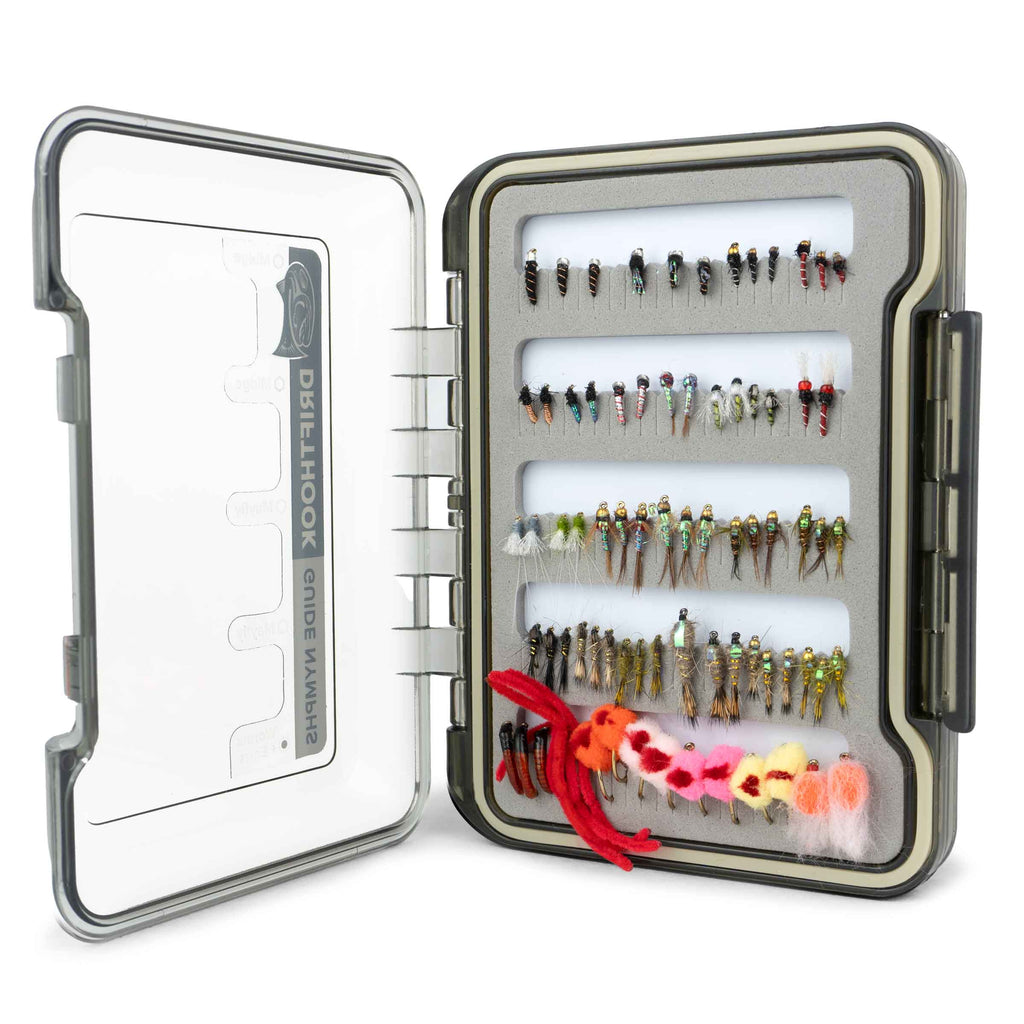 Open fly fishing lure case with various lures inside on a white background