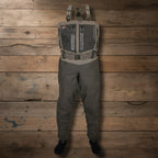 Waders with a chest pocket and straps on a white background