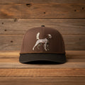 Brown cap with a dog illustration on a white background