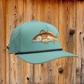 Light blue cap with fish embroidery on a white background