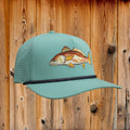 Light blue cap with fish embroidery on a white background