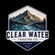 A stylized mountain-and-river landscape graphic inside a badge-like outline, with the text 'CLEAR WATER TRADING CO.' and 'EST.