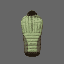 A green and dark gray puffer sleeping bag laid flat on a weathered wooden board in a forest setting with trees and fallen leaves visible.