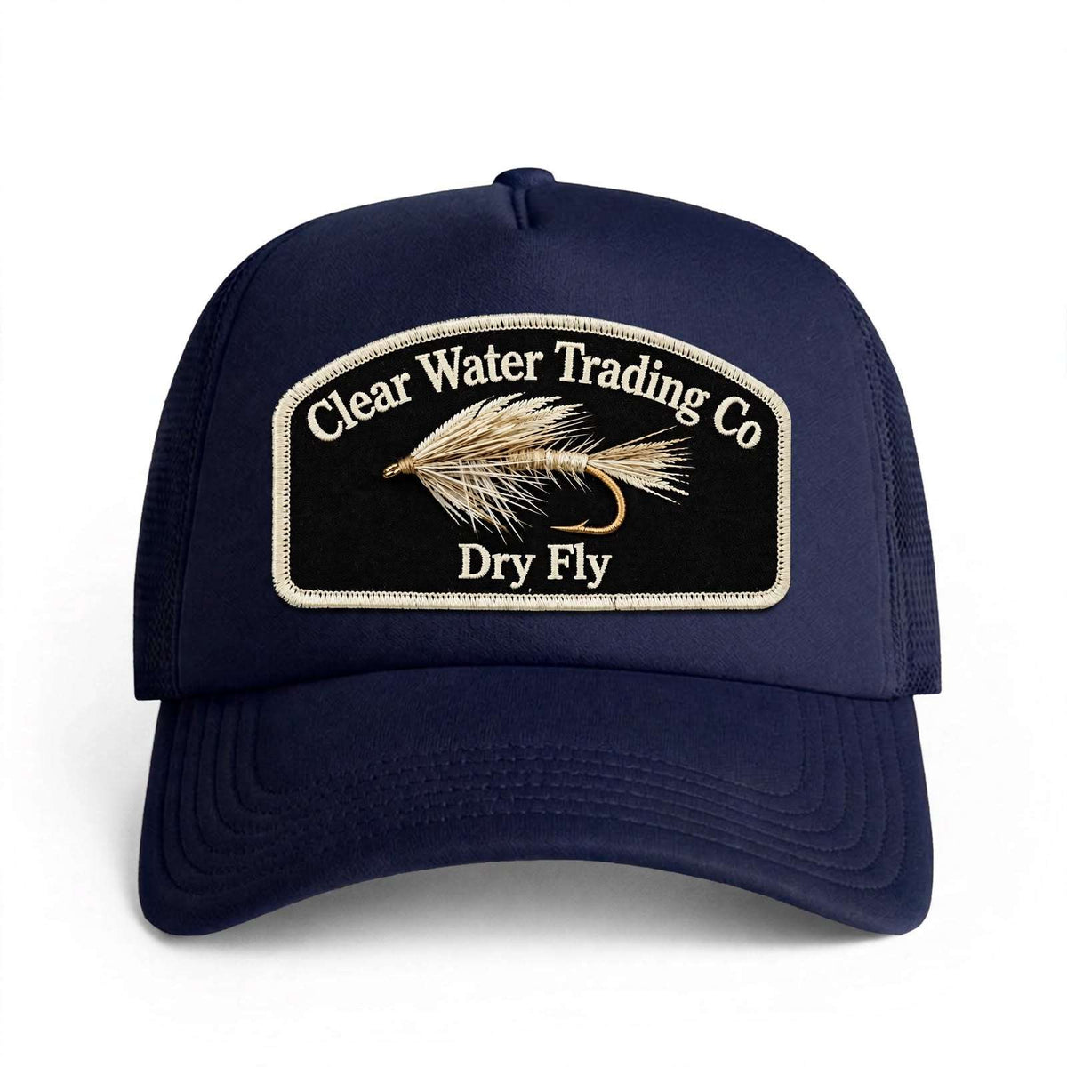 A navy blue trucker-style baseball cap with a black embroidered patch on the front. The patch features a tan fly fishing hook and line design with the text 'Clear Water Trading Co' and 'Dry Fly' in white.